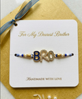 TNT Designs Stylish BRO Letter Rakhi for Brother | Navy Blue Gold Twisted Thread Rakhi with Bead Accents | BRO Design for Brother with Diamond Studded Letters