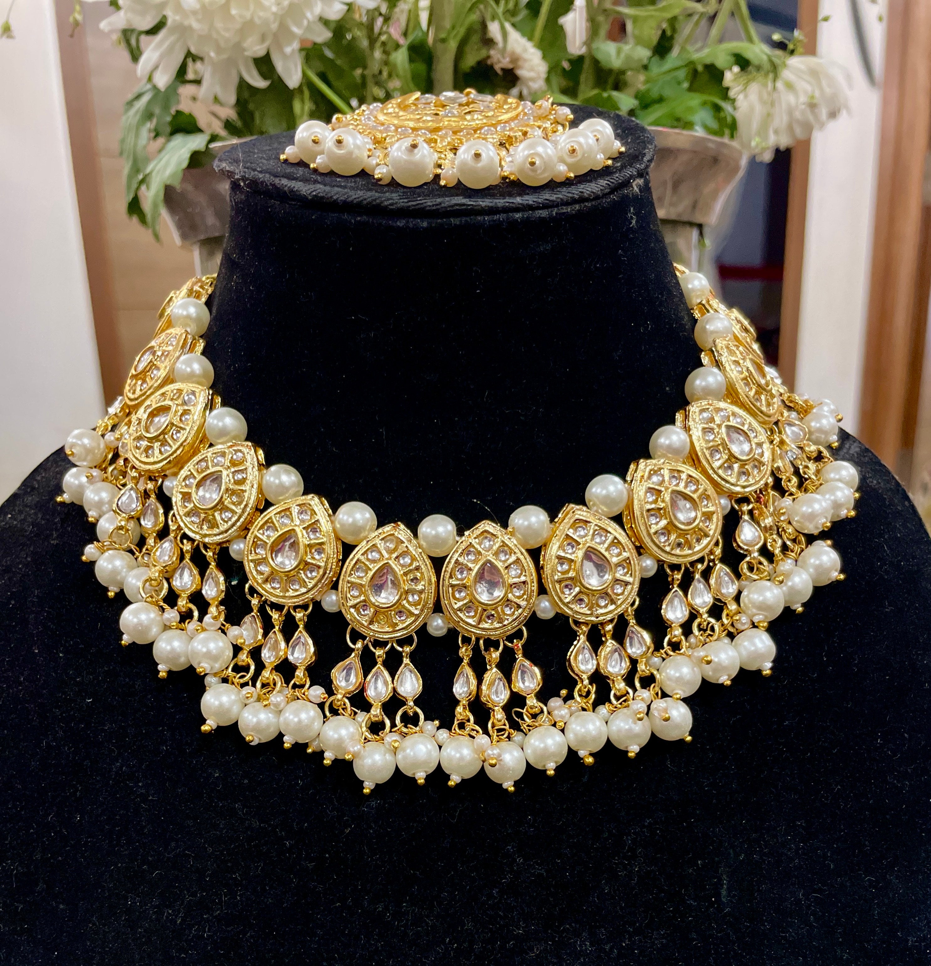 Nayantara kundan necklace set with earrings and teeka
