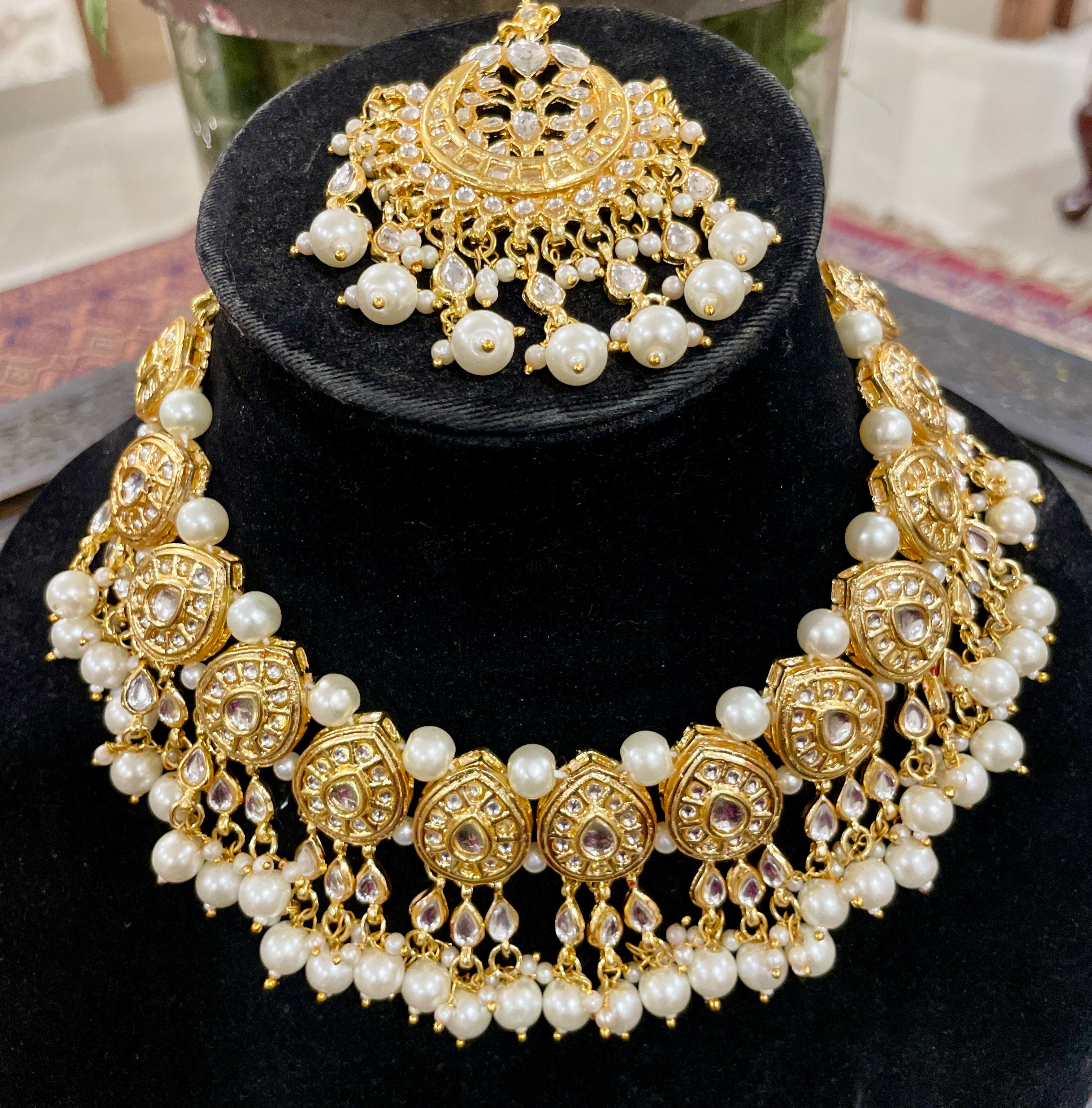 Nayantara kundan necklace set with earrings and teeka