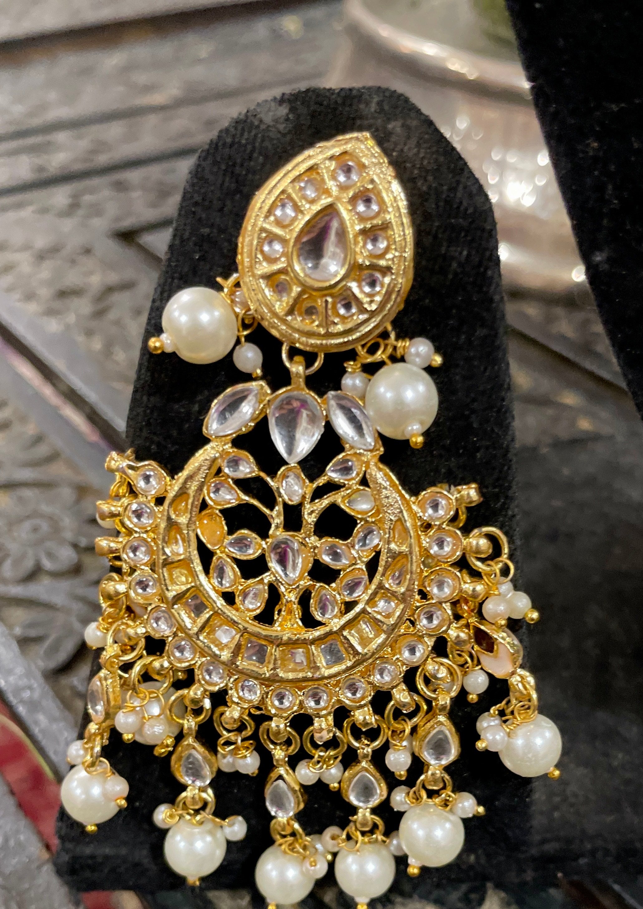 Nayantara kundan necklace set with earrings and teeka