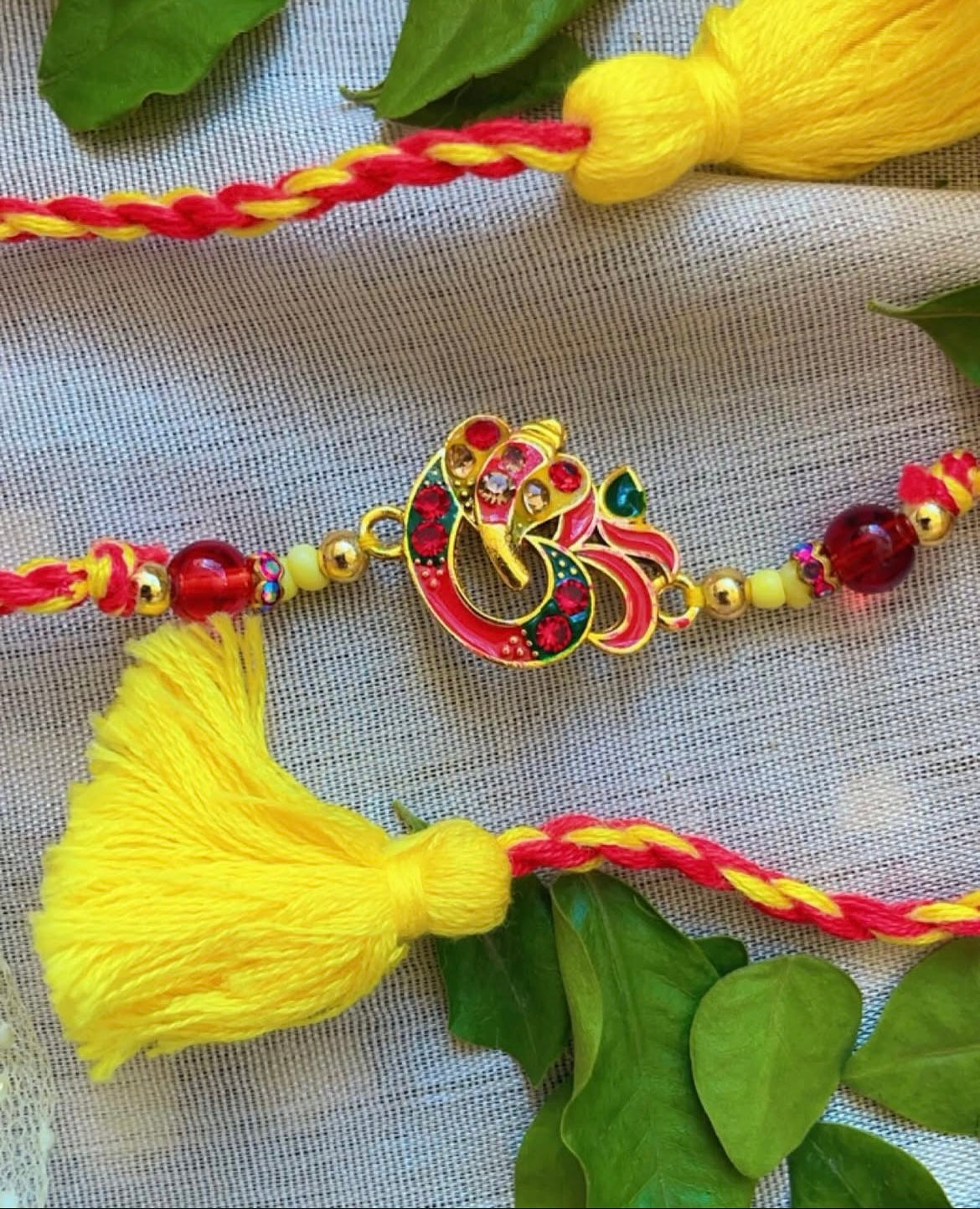 Red Ganesha rakhi combo - Rakhi for bhai and bhabhi